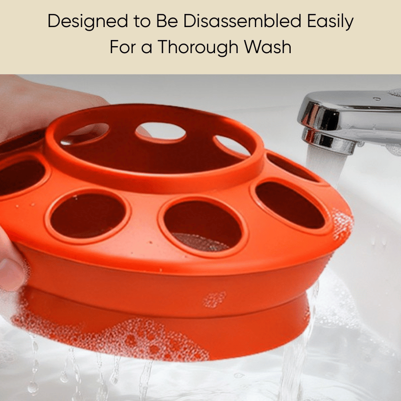 Part of orange automatic chicken feeder being washed in a sink with text indicating it is designed for easy disassembly.